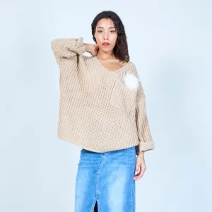 Loose knit sweater with feather detail wholesale
